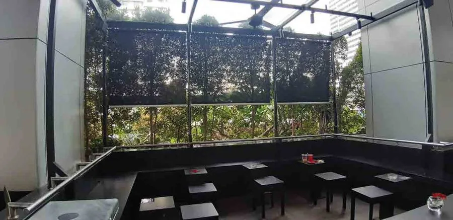 Outdoor terrace blinds operated automatically on a building facade