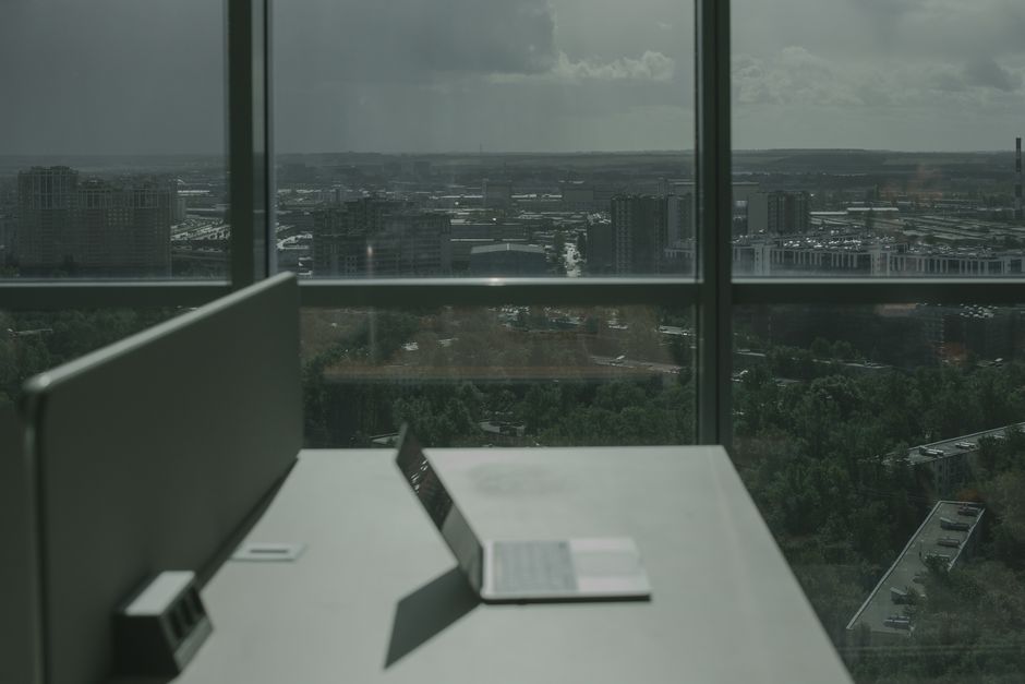 Office with large west-facing windows that demand UV-resistant blind fabric