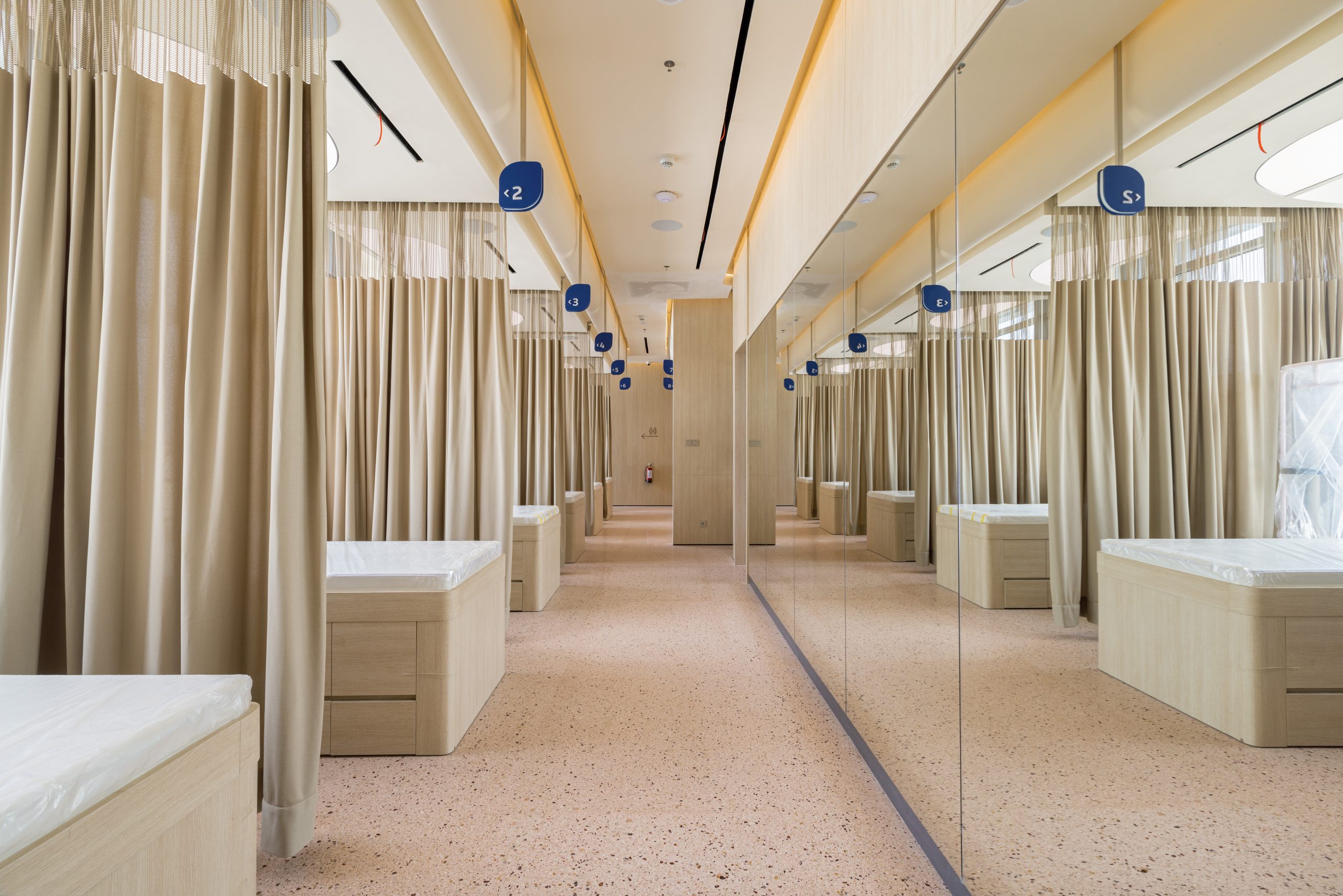 Hospital cubicle curtains installed in a clinic ward